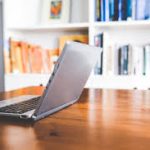 Laptop on top of wooden table